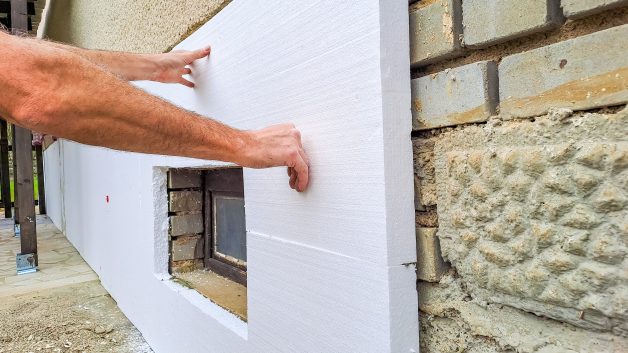 https://www.naki-naki.co.il/wp-content/uploads/2026/10/installing-rigid-styrofoam-insulation-board-energy-saving-house-wall-628x353.jpg